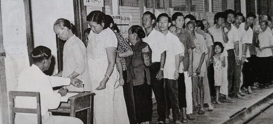 Voters forming a queue before casting their votes.